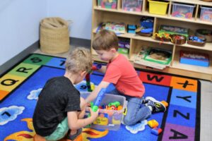 boys playing together during in-person preschool